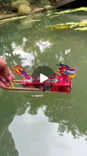 Paper Craft Ideas on Instagram: "Watch as we bring a magical dragon boat to life with just a few simple materials! Begin by securing two ice cream sticks on both sides of a juice box to create the sturdy base of the boat. Next, fashion a propeller by attaching elastic hairbands to two additional ice cream sticks, ensuring our boat has the perfect propulsion system. Add the finishing touch with a vibrant dragon cutout, transforming our simple boat into a whimsical dragon vessel. Now, your charming dragon boat is ready to embark on countless imaginary voyages, delighting in every adventure it encounters!" Milk Carton Crafts, Whimsical Dragon, Leftover Milk, Magical Dragon, Simple Boat, Make A Dragon, Boredom Busters For Kids, Ice Cream Sticks, Fun Group Games