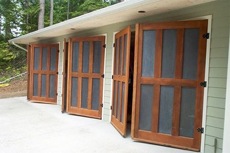 8 Garage Door Alternatives That Offer Style & Functionality | Worst Room Barn Door Garage, Small Garage Door, Shop Garage Doors, Exterior Garage Door, Barn Style Garage, Door Alternatives, Double Garage Door, Garage Door House, Carriage House Doors