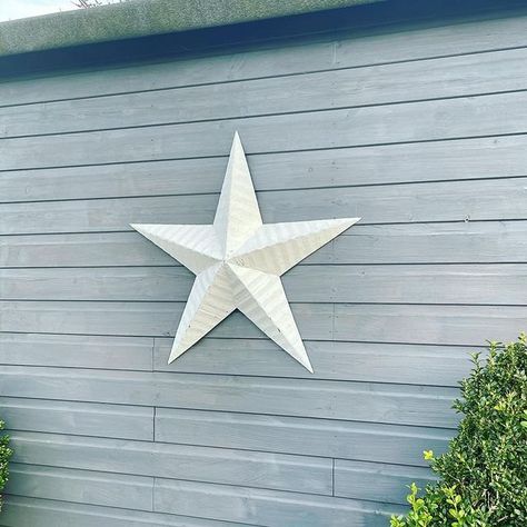 Why Do People Put Stars on Their Houses? | Hunker Stars On Houses Exterior, Decor To Hang On House Exterior, Outdoor Star Decoration, Star On House Exterior, Exterior House Decor Hanging, Metal Stars Decor Outdoor, Metal Stars Decor Ideas, Western House Exterior, Barn Star Decor