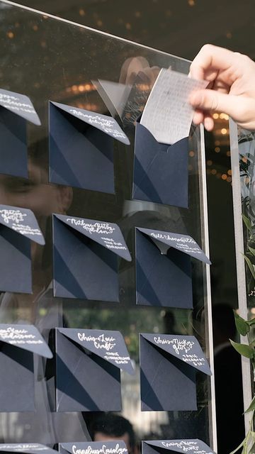 Austin Wedding Videographer on Instagram: "Is your escort wall meaningful or just a sign? Ashley and Tim included handwritten notes to each guest on a stunning ombré envelope wall titled “it takes a village.” It induced both laughter and tears and drew quite the crowd outside the tent. . . . Escort Wall and hand-lettered envelopes by the incredible @letteredbyvalerie Other vendors include @vidafilmproductions @florafetish @ashleyjett1 @missionstylehouse @timmyv17 @lootrentals @heavenlyd Seating Wall Wedding, Handwritten Letters For Wedding Guests, Handwritten Note Seating Chart, Wedding Guest Letter Wall, Handwritten Letter Seating Chart, Handwritten Notes To Wedding Guests, Envelope Wedding Seating Chart, Envelope Wall Wedding, Wedding Seating Chart Envelopes