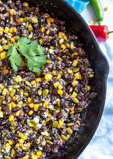 These Mexican Beans and Corn (Frijoles con Elote) get a flavor boost from a mixture called a sofrito that’s made of chiles, onion and garlic dry roasted then blended together. Top with cheese and pumpkin seeds and it's a fantastic side dish. #Mexican #beans #corn #side Black Bean And Corn Side Dish, Mexican Corn And Black Beans, Corn And Black Bean Side Dishes, Black Beans And Corn Side, Vegetarian Beans, Mexican Beans, Corn Side, Elote Corn, Elote Recipe