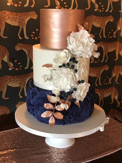 Rose gold and navy blue wedding cake, coordinating sugar flowers Navy Blue And Rose Gold Cake Ideas, Blue And Rose Gold Wedding Cake, Navy Blue And Rose Gold Cake, Navy Blue And Rose Gold Birthday Party, Navy Blue And Rose Gold Party Decor, Navy Blue Purple And Rose Gold Wedding, Navy And Rose Gold Decorations, Simple Wedding Cake Navy Blue, Navy And Rose Gold Wedding Cake