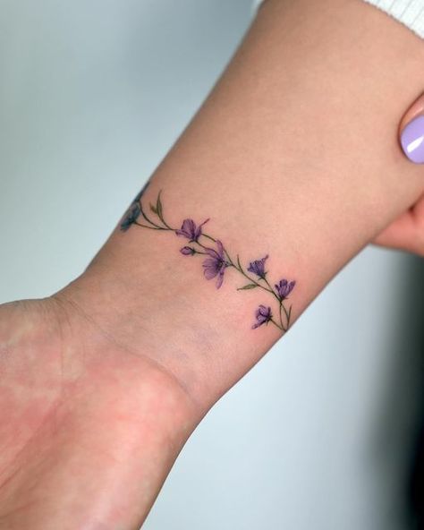 Morning Glory Arm Band Tattoo, Wrapped Flower Ankle Tattoo, Wrap Around Bracelet Tattoo, Violet Bracelet Tattoo, Wildflower Armband Tattoo, Forget Me Not Wrap Around Tattoo, Ivy Bracelet Tattoo, Flower Wrist Tattoos For Women Bracelet, Floral Wrist Band Tattoo