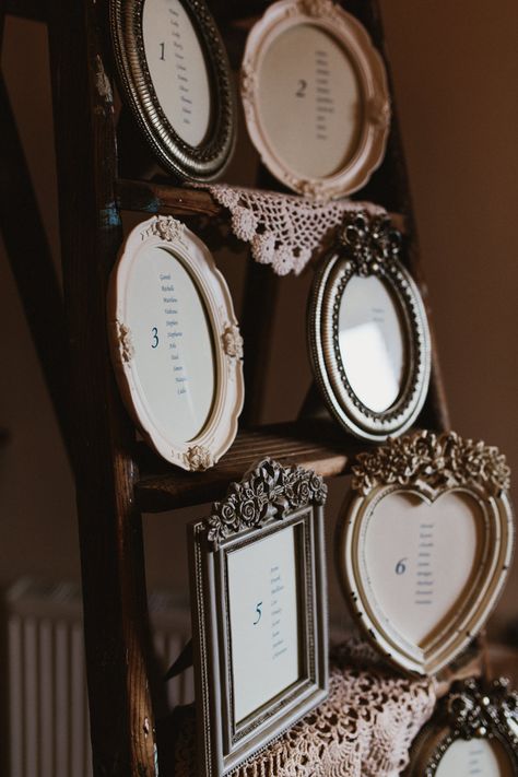 Vintage Step Ladder Table Plan with Ornate Frames & Doily Decor | Ally M Photography Table Plan Ladder, Table Seating Chart Wedding Ladder, Vintage Frame Seating Chart, Old Picture Frame Table Numbers, Royalty Wedding Theme, Vintage Pastel Wedding, Framed Doilies, Vintage Gold Frame Table Numbers, Victorian Wedding Themes