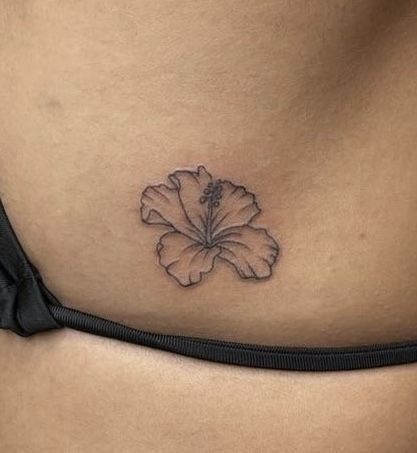 Hibiscus Lower Back Tattoo, Dominican Flower Tattoo, Small Rib Flower Tattoo, Moana Flower Tattoo, Hibiscus Tattoo Behind Ear, Delicate Hip Tattoo, Bahamas Tattoo Ideas, Hibiscus Tattoo Hip, Hibiscus Ankle Tattoo