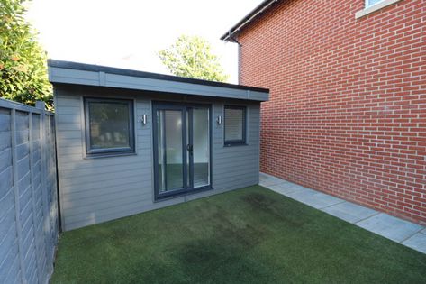 Garden office with composite cladding | The Garden Room Guide Cladding Garden Room, Garden Office Exterior Colours, Composite Cladding Exterior, Garden Office Corner Desk, Composite Cladding Garden Room, Small Garden Office Pod, Pvc Cladding, Garden Gym, Garage Extension