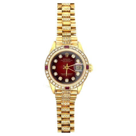 Rolex "Oyster Perpetual DateJust" lady's wristwatch, circa 1979 Automatic, circular red dial with dark burnt edges and applied aftermarket diamond markers, sweep seconds and cyclops date aperture, aftermarket ruby and diamond-set bezel, screw down crown, sapphire crystal, President link bracelet with aftermarket single-cut diamonds, deployant clasp, dial, movement; case and clasp signed Rolex Marked Superlative chronometer officially certified Movement no. 612389, case no. 6075657 Size: width 1 Vintage Rolex Watches Women, Woman Rolex Watch Gold, Women’s Rolex Vintage, Red Rolex Watches Women, Funky Watches, Rolex Oyster Perpetual Womens, Rolex Oyster Perpetual Datejust, Rolex Watches Women, Oyster Perpetual Datejust