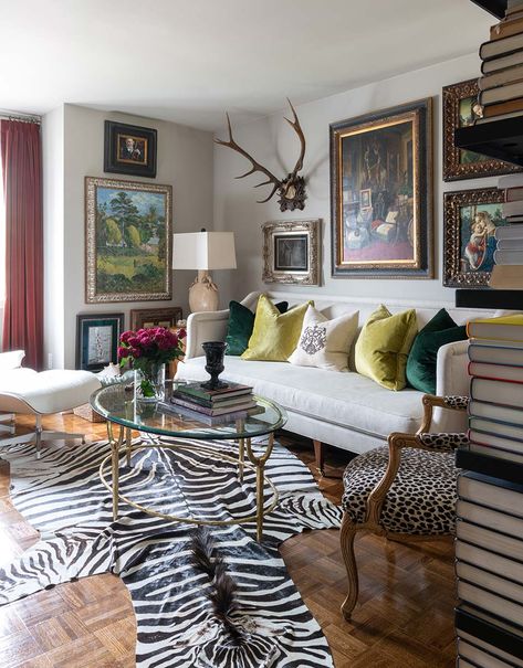 M. James Design Group | Creating a mood for every home Living Room With Leopard Accents, Zebra Rugs In Living Room, Zebra Print Interior Design, Mixing Animal Prints Decor, Eclectic Classic Living Room, Animal Print Living Room Ideas, Zebra Rug Living Room, Leopard Living Room, Colorful Bungalow