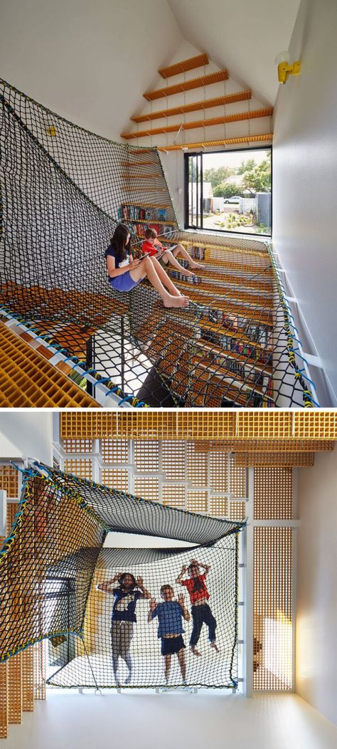 This book room features a large system of suspended nets that create the perfect spot to curl up with a book, a game, or spy on the people down below. Indoor Hammock Bed, Hang Out, Indoor Hammock, Houses In France, Hammock Bed, Book Room, Tower House, Home Libraries, Loft Spaces