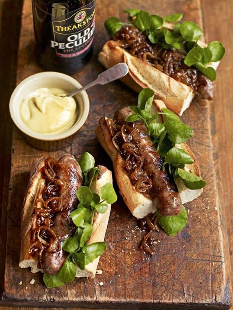 These hot dogs with beery onions from Debbie Major make a perfect TV supper on a Friday night. Sausage Hot Dogs, Bonfire Night Food, Cumberland Sausage, Gastro Pub, Sandwich Bar, Fingerfood Party, Hot Dog Recipes, Delicious Magazine, Night Food