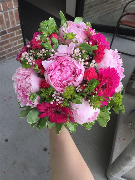 Hand-tied bridesmaid bouquet with peonies, gerber daisies, spray roses, wax flower, bupleurum & variegated pittosporum