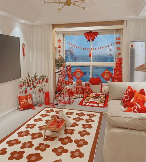 On this day of Chinese New Year, Chinese families often carefully decorate their living rooms, mainly red, which means good luck and joy in traditional Chinese culture. Livingrooom，as a place to entertain guests, it is natural to take this element to the extreme! Follow me for more～ Cny Home Decoration, Chinese New Year Decorations Home, Chinese New Year Decor, Cny Decoration, Chinese Room, Tet Holiday, Chinese New Year Decorations, Feng Shui Tips, Red Decor