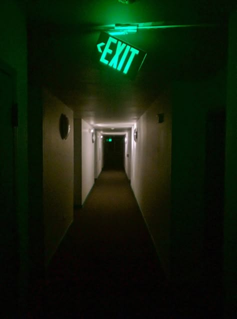 Green Exit Sign dangling in a eerie Hallway ~ Low Light Night Photography Low Light Photography Outdoor, Over And Over, Exit Wallpapers, Exit Door Aesthetic, Low Light Photography Ideas, Infinite Hallway, Exit Sign Aesthetic, Eerie Signs, Scary Lighting