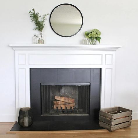 Wondering if you can paint fireplace tile surround? Check out this guide for all the tips and tricks for refacing tile for a fireplace makeover! And see what this black and white beauty looked like before! Painting Tile Around Fireplace, Tiled Fireplace Surround, How To Paint Fireplace, Tile Fireplace Makeover, Paint Fireplace Tile, White Fireplace Surround, Painted Fireplace Mantels, Tile Around Fireplace, White Mantle