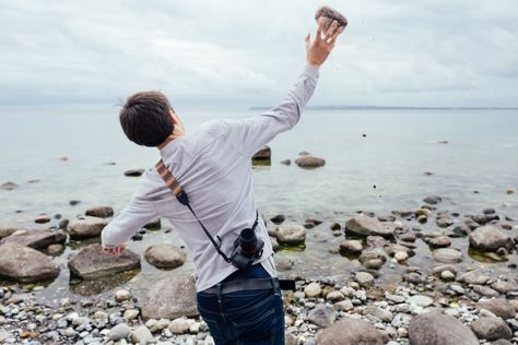 Download this free HD photo of Guy throwing rock in water for personal and commercial use.    Tags adult, background, environment, freedom, fun, guy, lifestyle, male, man, nature, people, person, photographer, rock, sea, Splash, stone, summer, throwing, travel, water, young Background Environment, Egypt Pyramids, Nature People, People Person, Pose References, Male Man, Art Poses, Big Bang, Stone Art