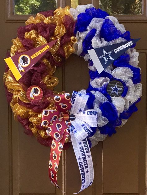 Divided by the gridiron, united in love! Can be customized for any 2 sports teams you choose. This 23 inch Deco Mesh Wreath with Handmade Bow and Embellishments represents my hometown team the Washington Redskins and our arch rivals the Dallas Cowboys. Visit my Facebook page, www.facebook.com/theoccasionalwreath for details or contact me via email at theoccasionalwreath.kim@gmail.com to place your custom order. Nfl Wreaths Diy Deco Mesh, Football Wreath Form Cowboys, Sport Team Wreaths Deco Mesh, Dallas Cowboy Door Wreath, Football Shaped Wreath, Football Team Wreaths, Houston Texans Wreath Deco Mesh, Dallas Cowboys Wreath, House Divided Wreath