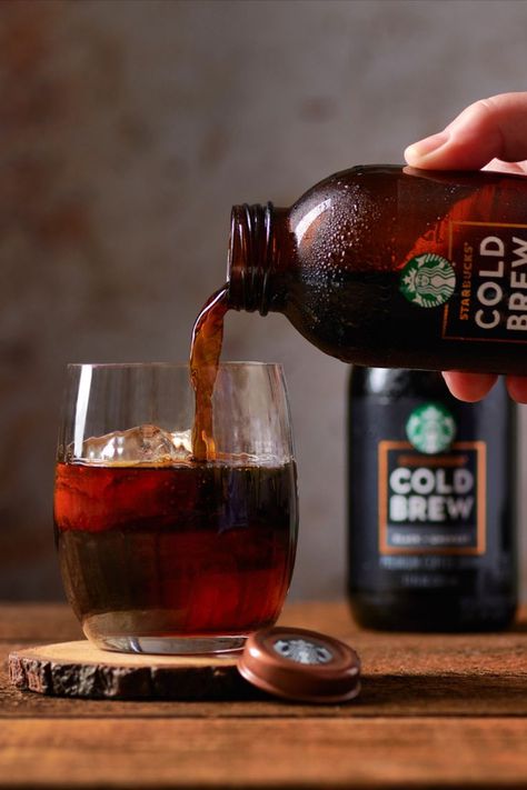 For this beverage photo I wanted to create a sense of movement and interaction. By pouring the Starbuck's Cold Brew into a glass, I was able to add a "human" element. Using a wood table I was able to create a warmer tone to the image. Cold Brew Packaging, Human Element, Beverage Photography, Jennifer Lee, Coffee Shot, Coffee Illustration, Coffee Photography, Cold Brew Coffee, Coffee Cafe