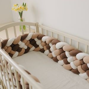 Cushion Design Ideas, Cozy Corner Ideas, Braided Crib Bumper, Crib Pillows, Baby Crib Bumpers, Cushion Ideas, Baby Bumper, Corner Ideas, Knot Cushion