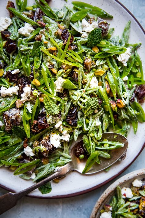 A festival of colors, this shaved snap pea salad recipe is as springy as salads get. Sweet peas are tossed with pistachios, dates and fresh mint, then tossed in creamy goat cheese dressing. Sugar Snap Pea Recipe, Snap Peas Recipe, Sweet Snap, Snap Pea Salad, Salad With Goat Cheese, Pea Salad Recipes, Spring Salad Recipes, Snap Pea, The Modern Proper