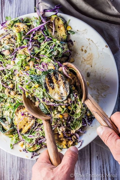 I have been told that this Grilled Zucchini Salad is THE BEST salad ever. It's loaded with summertime favorites like grilled zucchini and corn, alfalfa sprouts, purple cabbage, and healthy chickpeas and tossed in a super creamy and easy to make sunflower seed dressing. It's a healthy side dish that is naturally vegan gluten-free. | theendlessmeal.com Roasted Chickpeas Salad, Grilled Zucchini Salad, Salad Zucchini, Chickpeas Salad, Grill Corn, Grilled Squash, Best Salads Ever, Red Cabbage Salad, Vegan Grilling