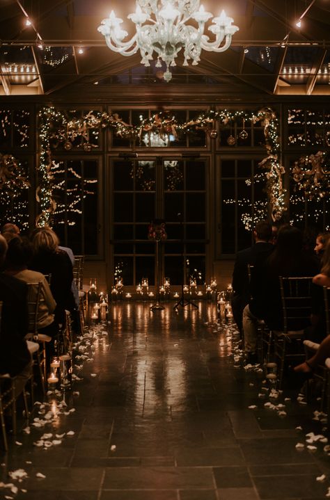 Winter wedding ceremony setup Candlelit Winter Wedding, Dark Wedding Ceremony, Dark Christmas Wedding Inspiration, Goth Venue Wedding, Dark Candle Wedding Decor, Dark Candle Wedding, Winter Dark Wedding, Moody Wedding Aisle, Dark Vibe Wedding