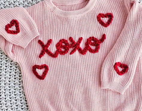 A custom hand embroidered Valentine's sweater is perfect for your little one or a heartfelt gift for a friend or family member! Sweaters are available in a range of colors and feature an oversized fit. Your sweater will feature a hand embroidered XOXO's in the color combinations of your choice. Trendy Pink Embroidered Sweater, Pink Cotton Sweater With Custom Embroidery, Hand Embroidered Valentines Sweater, Valentines Embroidered Sweater, Knit Embroidery Sweater Name, Embroidered Sweater Kids, Embroidery Sweater Diy, Hand Embroidery Letters, Personalized Sweater