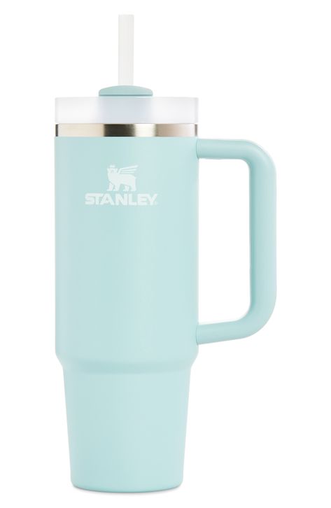 Hit your daily hydration goals with style and ease using Stanley's fan-favorite 30-ounce Quencher Travel Tumbler.What it does: Made from stainless steel with double-wall vacuum insulation, this tumbler helps keep liquids cold for hours on end. The tumbler will keep ice for up to two days, keep your drinks cold for up to 11 hours and keep your drink hot for up to seven hours.Additional features: The three-position lid features an opening for a straw, an opening for sipping and a full-cover top th Stanley Cup Seafoam, Water Bottles Stanley, Stanley Excessories, Small Stanley Cup, Flip Straw Stanley, Decorated Stanley Cup, Teal Stanley, Cute Water Bottles Aesthetic, Cute Stanley Cups