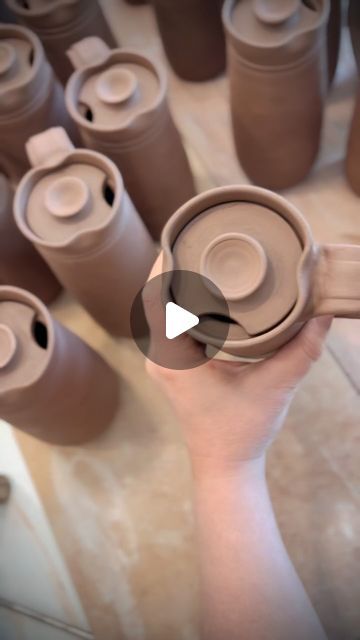 Dault Pottery on Instagram: "We need your help answering a question although as I type this out…I’m pretty sure David’s opinion is going to win…  Should there be a drinking spot carved into both sides  of the travel mug making them work for both right and left handed people OR should we keep it to only one side but let people choose their preference?  I personally don’t like the way the mug looks when I carve both sides out because visually it’s just too busy and it seems too open.  David makes the argument that if we go ahead and make them ambidextrous, they would be way more practical and functional and it would eliminate any need to keep track of who needs a left handed mug.  What do you think about it?" Practical Ceramic Pottery, Throwing Techniques Pottery, Pottery Travel Mug Ideas, Travel Mug Pottery, Ceramic Takeaway Cup, Ceramic Travel Mug With Lid, Throwing Mugs On The Wheel, Easy Pottery Ideas For Beginners Wheel, Ceramic To Go Mug