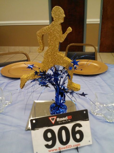 Centerpieces for Track & Field banquet. Used runners bib for table numbers. #sports, #centerpieces, # runners, # track & field ,#marathon, # cross country, # table numbers Track And Field Themed Party, Track Centerpiece Ideas, Running Centerpieces, Track And Field Party Decorations, Marathon Party Theme, Cross Country Centerpiece Ideas, Cross Country Banquet Centerpieces, Track Banquet Centerpieces, Banquet Centerpiece Ideas