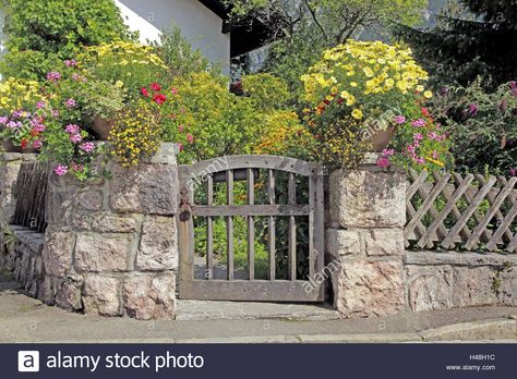 Download this stock image: Garden door, stone defensive wall, floral decoration, Germany, Bavaria, Upper Bavaria, door, little door, garden door, lowly, wooden, wooden, defensive wall,hunters fence Stone Garden Fence, Fence On Top Of Stone Wall, Diy Stone Fence, Small Garden Gates, Stone Garden Wall, German Cottage, House Planner, Cottage Woods, Stone Fence