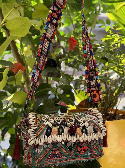 "VINTAGE BANJARA BAG Our patchwork Banjara boho bags are the perfect accessory to complete any bohemian-inspired look. Made with a unique combination of colorful and patterned fabrics, these bags feature intricate stitching and embroidery, making each bag one-of-a-kind. Perfect for carrying all your essentials, these bags are both stylish and functional. With their comfortable shoulder straps and spacious interior, you'll never have to sacrifice style for practicality. height : 8\" width : 12\" We have more colours in banjara bags.check our page for more details. PLEASE MENTION YOUR CONTACT NUMBER AT THE TIME OF PURCHASE ITS REQUIRED FOR FAST AND EASY SHIPPING PURPOSE. if any question about product feel free to contact us." Indian Bags, Kutchi Work, Tote Bag Outfit, Bohemian Handbags, Patterned Fabrics, Boho Handbag, Boho Clutch, Bohemian Bag, Ethnic Bag