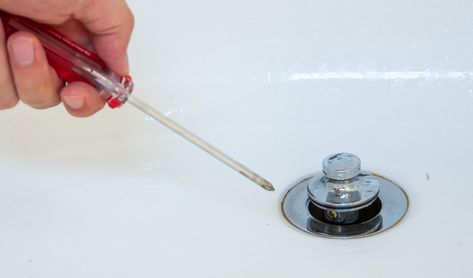 If your bathtub stopper is stuck or the tub is not draining properly, the best way to diagnose what's wrong is to remove the stopper entirely. Learn how. How To Replace Bathtub Faucet, Bathtub Drain Replacement, How To Remove Tub Drain Plug, Installing Bathtub, Modern Gothic Bedroom, Remove Bathtub, Clogged Drain Bathtub, Bathtub Drain Stopper, Sink Repair