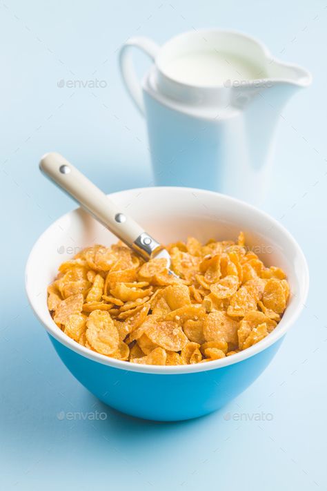 Breakfast cereals or cornflakes. by jirkaejc. Breakfast cereals or cornflakes in bowl and milk on blue background.#cornflakes, #jirkaejc, #Breakfast, #cereals Cereals Photography, Bts Ff, Healthy And Unhealthy Food, Short Tempered, Crunch Cereal, Bowl Of Cereal, Cold Hearted, Corn Flakes, Breakfast Items