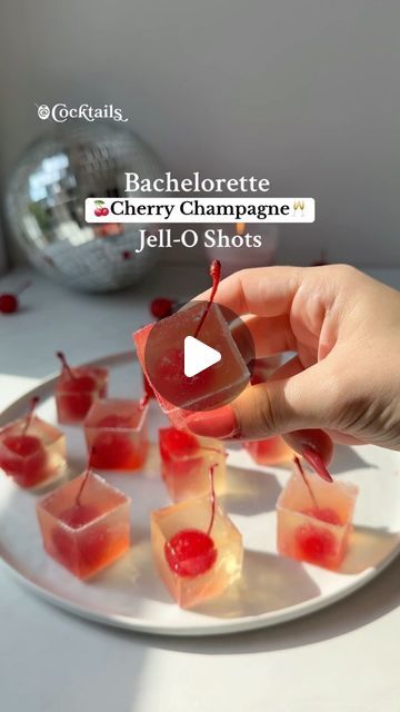 Cocktails (21+ to follow) on Instagram: "Celebrate the bride-to-be with these adorable Cherry Champagne Jell-O Shots! 🍒🥂 Packed with champagne, cherries, and plenty of glitter, they’re the perfect addition to your Bachelorette weekend!✨💍 #cherrychampagnejelloshots #bachelorettejelloshots #bachelorette #bacheloretteparty #bacheloretteideas #cherrychampagne #champagnejelloshots #cherry #champagne #jelloshots #jelloshotideas #jelloshotrecipes #summer #partyideas #cherries #boozyIngredients: -1.5 cups champagne, divided -1/3 cup sugar -2 tbsp. lemon juice -2 packages gelatin -1/2 cup vodka -1/2 cup champagne -edible glitter -maraschino cherries" Pink Champagne Jello Shots, Bachelorette Jello Shots, Cherry Bachelorette Party, Cherry Champagne, Tequila Jello Shots, Cherry Jello Shots, Bachelorette Food, Champagne Jello, Champagne Jelly