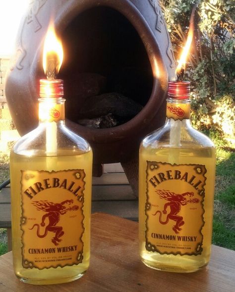 Fireball bottles repurposed as tiki torches. Fireball Decorations, Fireball Bottle, Fireball Drinks, Diy Bottle Lamp, Surprise 50th Birthday Party, Fireball Whiskey, Creative Birthday Gifts, Tiki Torches, Bottle Lamp