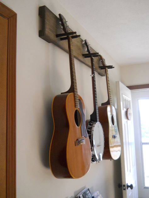 DIY guitar hanger - simple & secure! We practice so much more since we've put this up. Music Studio Room Diy, Hang Guitar On Wall, Guitar Stand Wall, Diy Guitar Stand, Guitar Wall Mount, Guitar Holder, Guitar Storage, Guitar Wall Hanger, Guitar Display