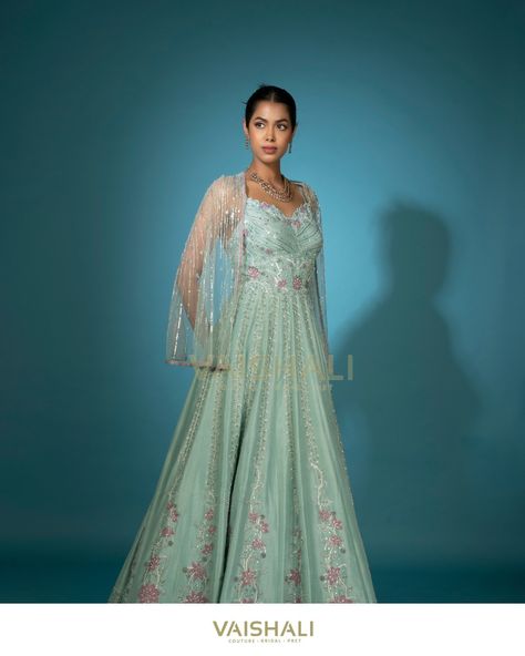 This Sea Green Gown is accentuated with pink applique, cutdana, and sequins, while the hem is intricately finished with scalloped thread work. It features a cutwork V neckline and comes with an embellished detachable cape net jacket. Jewellery by: @shivasajewellery #vaishaliagarwal #inarabyvaishaliagarwal #shivasabysandhyaagarwal #seagreengown #cocktailgown #embellishedgown #fashioninspiration #partydress Pista Green Embellished Gown For Reception, Embellished Pista Green Wedding Gown, Sea Green Gown, Green Semi-stitched Gown With Cutdana, Pista Green Anarkali Dress With Sequins, Semi-stitched Pista Green Gown With Intricate Embroidery, Pink Applique, Net Jacket, Detachable Cape