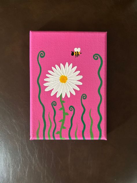 Painting of a daisy flower and a bee. Pink background with grass around the flower.   Size 5x7  Canvas  Acrylic Paint Easy To Do Paintings On Canvas, Painting On Pink Background, Summer Paintings Simple, Mother’s Day Painting Canvas Easy, Beginners Painting Ideas, Things To Paint For Mothers Day, Paintings For Mothers Day, Cute Disney Paintings Easy, Painting With Pink Background