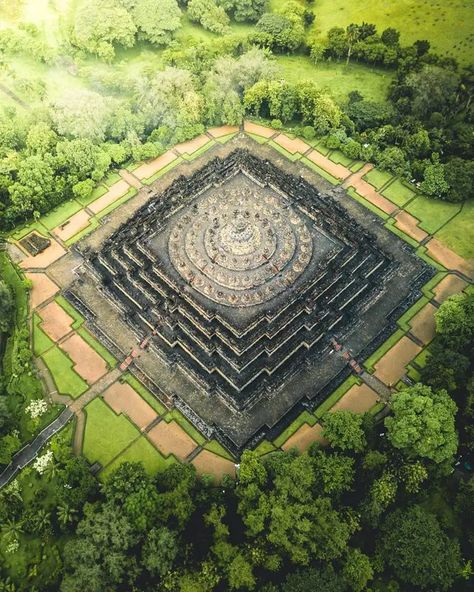 Borobudur is one of the great monuments of Southeast Asia. It is a colossal Buddhist stupa that rises out of the rice paddies and palm trees with the nearby volcano Gunung Merapi in the distance. Buddhist Architecture, Buddhist Stupa, Borobudur Temple, Central Java, Drone Images, Buddhist Temple, Birds Eye, Pilgrimage, Aerial View