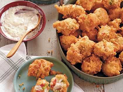 Crab Cake Hush Puppies | Serve these Crab Cake Hush Puppies with your favorite rémoulade or cocktail sauce for tasty appetizers. Hush puppies, a Southern classic made by deep-frying a cornmeal batter gets a seafood makeover. Served with a creamy, thick dipping sauce, these salty critters are a great option for a potluck meal or an appetizer that serves to impress. Freeze any leftovers and defrost up to 3 months later. Hush Puppies Recipe, Crab Cake, Finger Foods Easy, Crab Recipes, Crab Cakes, Croquettes, Fabulous Foods, Seafood Dishes, Beignets