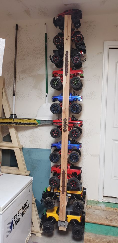 Boys Big Truck Storage, Remote Control Car Storage, Power Wheels Storage, Rc Car Storage Ideas Diy, Rc Car Storage Ideas, Rc Truck Storage Ideas, Monster Truck Organization, Monster Truck Toy Storage Ideas, Monster Truck Organization Boy Rooms