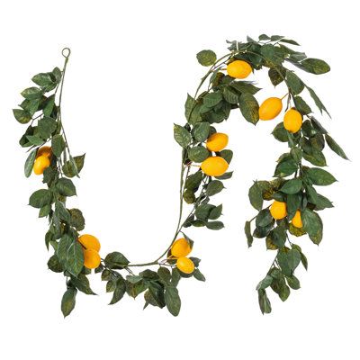 Vickerman 6' artificial green and yellow Salal leaf lemon garland featuring 52 branches with 14 lemons. This is a great finishing touch to any arrangement. This item is 6' tall from top to bottom and measures 72" H x 12" W x 12" L. The size of this garland makes it the perfect universal size to fit wherever you plan. It's lifelike leaves and delicate stems will give you the look and feel of a realistic artificial garland. Add color and greenery to any modern or traditional design. It features va Lemon Garland, Lemon Plant, Realistic Artificial Christmas Trees, Greenery Decor, Lemon Leaves, Artificial Garland, Greenery Garland, Wreaths And Garlands, Leaf Garland