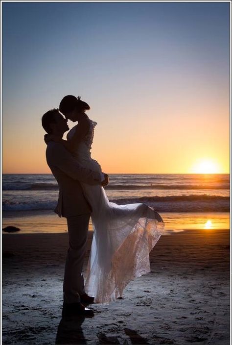 Love my wedding photo with the sunset in the background on the beach. Just be careful of your groom is wearing expensive shoes! Ocean water and leather isn't a good mix. Beach Wedding Sunset Pictures, Wedding Photos In The Ocean, Groom Beach Shoes, Unique Beach Wedding Photos, Beach Wedding Picture Ideas Photography, Sunrise Beach Wedding Ceremony, Ocean Wedding Pictures, Beach Wedding Photography Ideas, Beach Wedding Pictures Poses