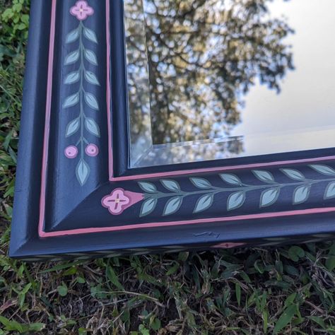 Still working my way through these mirrors 😁 Rectangle beveled mirror hand painted with bright pink flowers on a blue toned charcoal background with lots of leaves #handpaintedpictureframe #paintedframe #handpainted #handpaintedfurniture #colorfulhome #colorfulinterior #interiordesign #folkart #boho #bohostyle #bohodecor #botanicalart #botanical #uniqueinteriors #fusionmineralpaint #handpainteddecor #smithfieldva #virginiaartist #upcyclefurniture #upcycle Charcoal Background, Bright Pink Flowers, Furniture Flipping, Hand Painted Decor, Fusion Mineral Paint, Rectangle Mirror, Hand Painted Furniture, Beveled Mirror, Flipping Furniture