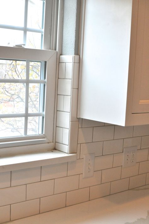 kitchen progress V: backsplash | spaghetti on bath night Kitchen Backsplash Window, Tile Around Kitchen Window, Kitchen Tile Splashback, Tile Around Window, Backsplash Window, White Kitchen Cabinet Doors, White Tile Kitchen Floor, White Kitchen Accessories, White Subway Tile Kitchen