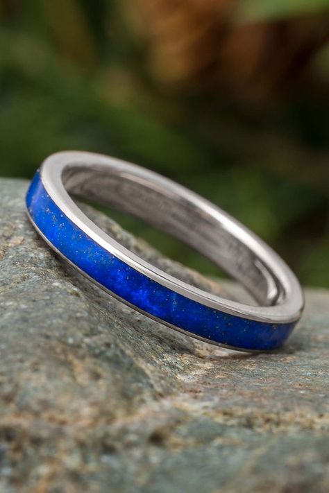 This dainty titanium wedding band is inlaid with lapis lazuli for a naturally colorful style. #JewelrybyJohan #Handmade #Lapis Blue Place Settings, Women's Wedding Bands, Blue Wedding Inspiration, Titanium Wedding Band, Blue Ring, Band Jewelry, Rose Yellow, Bold And Beautiful, Titanium Rings