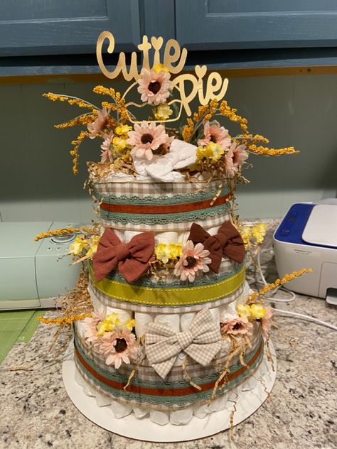 Fall theme “Cutie Pie” Baby Shower Diaper Cake Cutie Pie Baby Shower Theme Fall, Pie Themed Baby Shower Ideas, Cutie Pie Baby Shower Theme, Fall Diaper Cake, November Baby Shower, Baby Shower Diaper Cake, Cake Inspo, Baby Cakes, Fall Theme