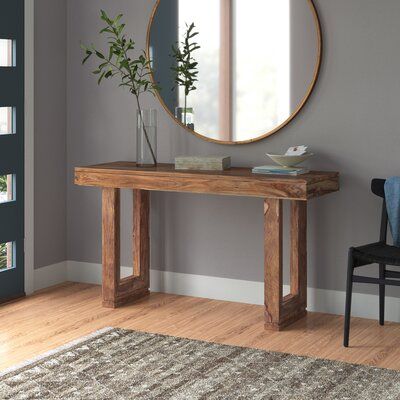 This solid wood console table features a simple silhouette that makes the stunning natural wood grain the star of the show. It's made from on-trend sheesham wood in a nut brown finish. It stands 30' ' tall on top of beveled sled legs with characterful notches around the bottoms. This sofa table is rugged enough to hold up to 242 lbs. worth of antique books and decorative ceramics. So worth it: The tabletop edges feature dovetail joints for quality craftsmanship you can see.Features:Finish: Nut b Console Table Decorating, Entrance Table, Front Entryway, Wooden Console, Wayfair Furniture, Sheesham Wood, Hall Table, South Bend, Wood Console Table