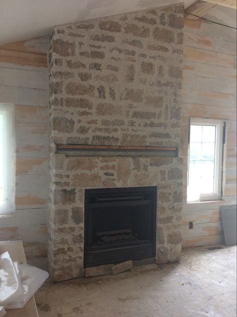 A renovation putting in a new gas fireplace. I was wanting that overgrouted rustic look. We took out windows and doors then reframed for a fireplace flanked by windows. My husband framed and placed the insert one day. Applied the stone the next day. Grouted another day. Stone Fireplace Windows On Each Side, Stone Fireplace Gas Insert, Stone Cottage Fireplace, Stone Fireplace With Gas Insert, Over Grout Stone Fireplace, Stone Gas Fireplace With Tv Above, Gas Fireplace With Stone Surround, Farmhouse Gas Fireplace Ideas, Overgrouted Brick Fireplace