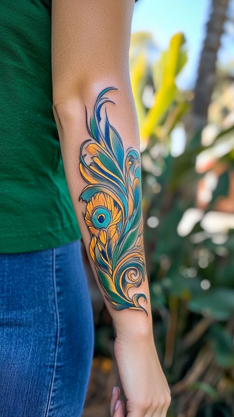 A vibrant watercolor tattoo of a peacock feather on a female's forearm, blending shades of blue, green, and gold. Show the tattoo from a slight distance, capturing the artistic fluidity without any inscriptions. Peacock Tattoo Sleeve, Watercolor Peacock Feather, Watercolor Tattoo Ideas, Watercolor Peacock, Create A Tattoo, Peacock Feather Tattoo, Peacock Tattoo, Tattoo Master, Indian Tattoo